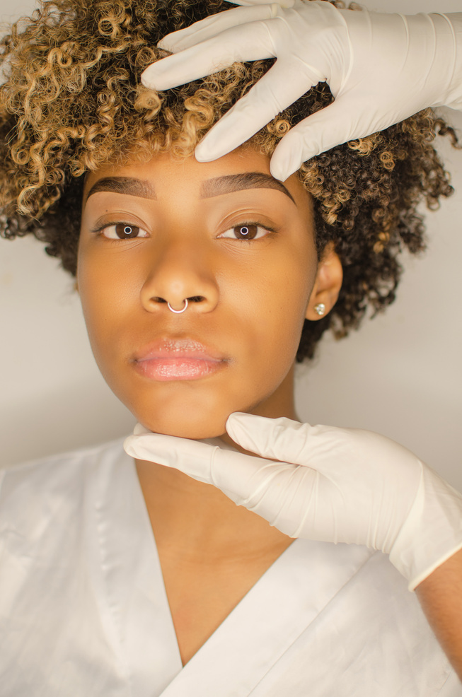 Beautician checking procedure with hands